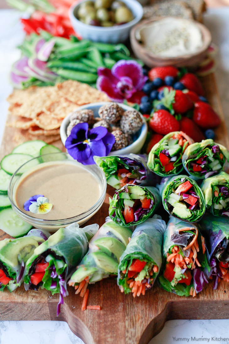 Fresh vegetarian and vegan spring rolls made with rice paper, avocado, bell pepper, and other veggies. Served with homemade peanut sauce, this spring roll recipe is so delicious. 