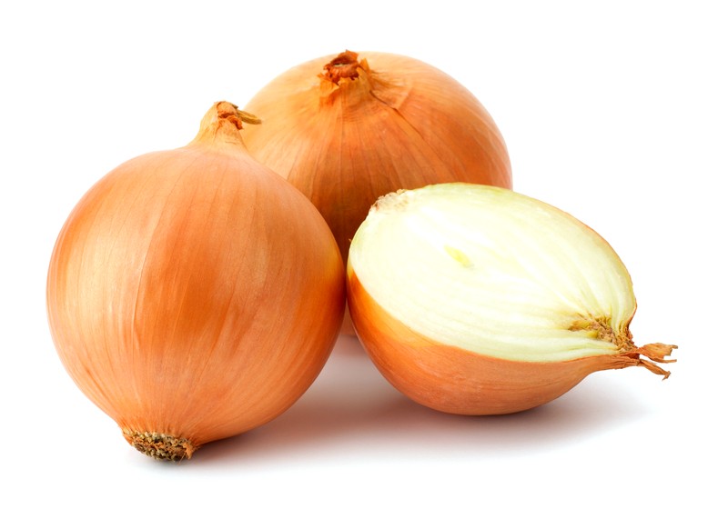 Fresh bulbs of onion on a white background